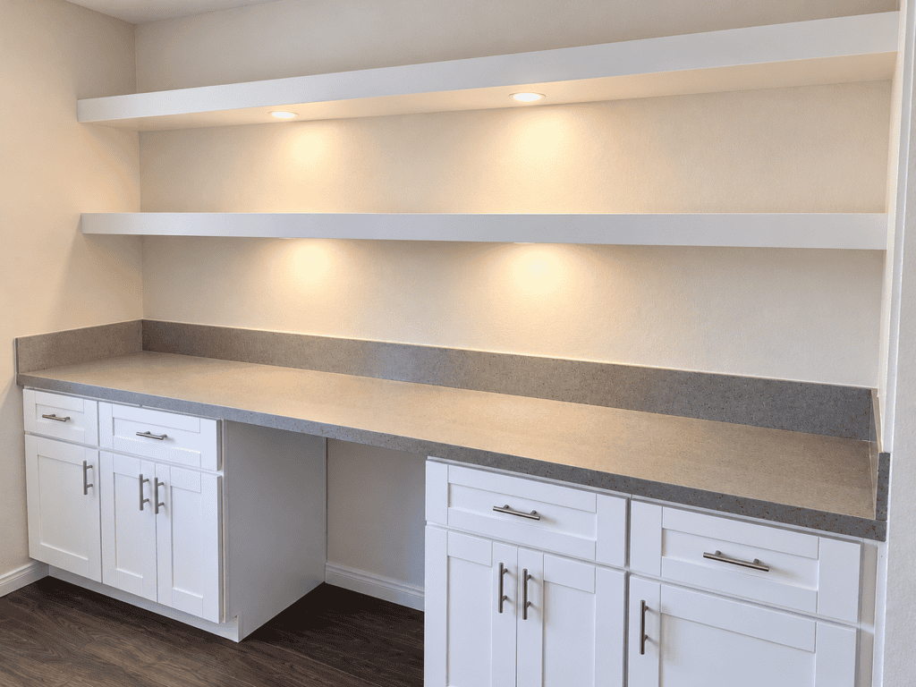 Contemporary kitchen with white cabinets and open shelving.